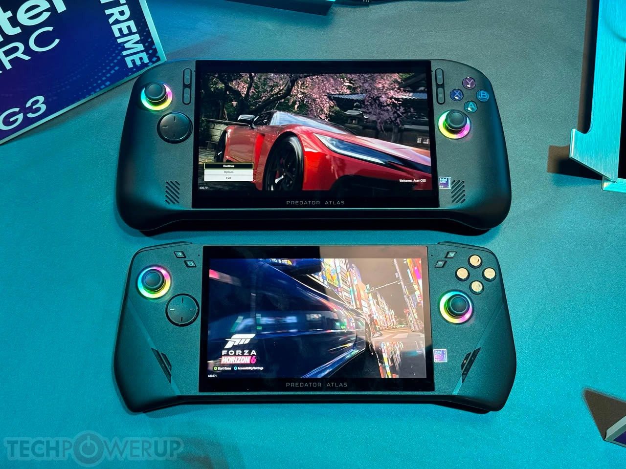 Hands holding a Predator Atlas 7 at IFA, with the screen on and rear LED visible