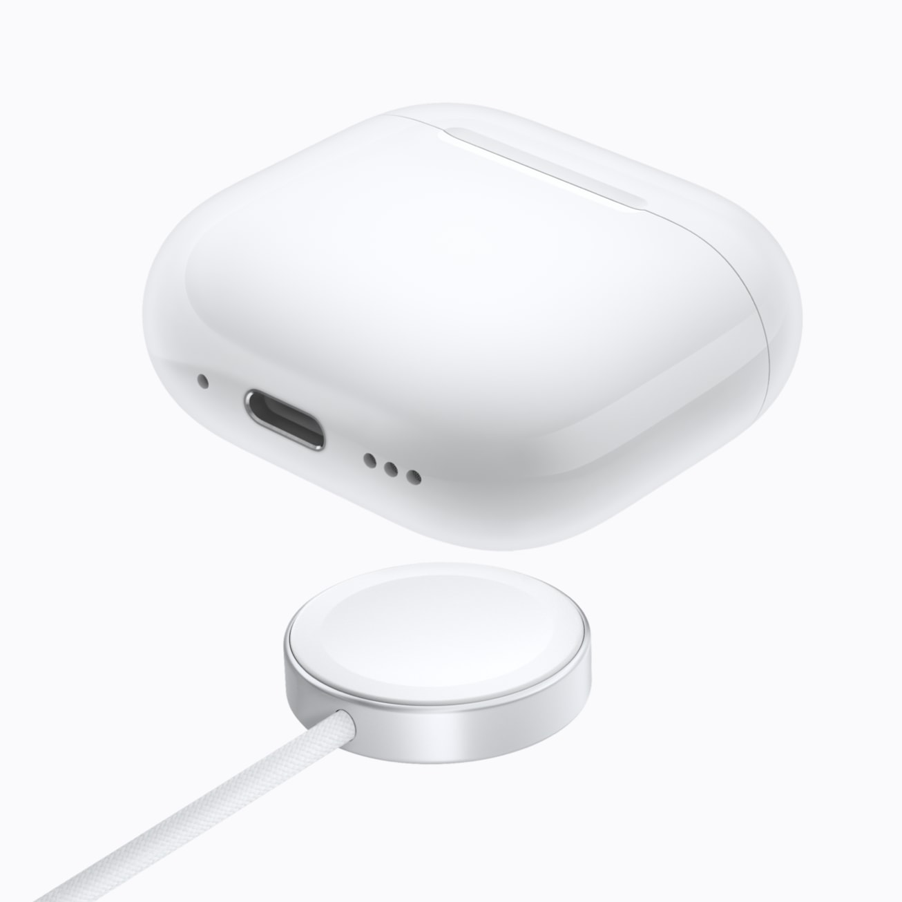 AirPods 5 Wireless Charging Case hovering above a MagSafe charger