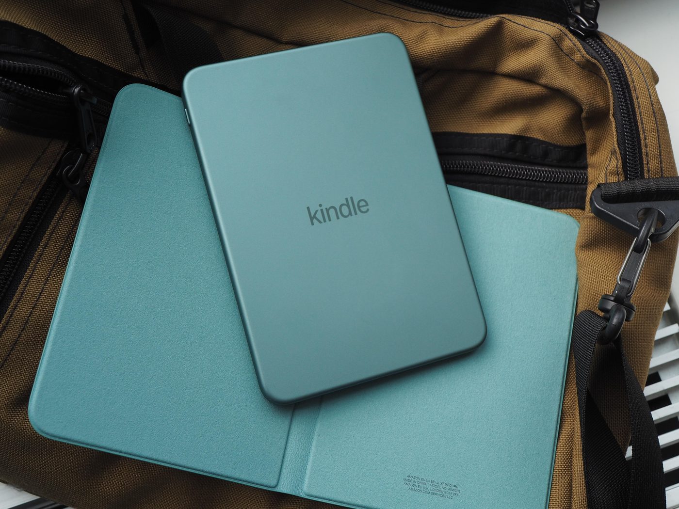 Amazon Kindle redesign with teal back on folio and bag