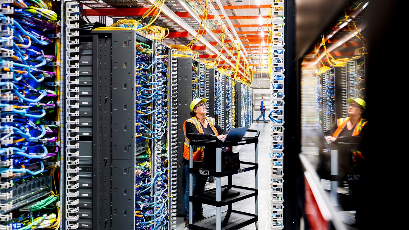 A technician inside an AWS Project Rainier data center.
