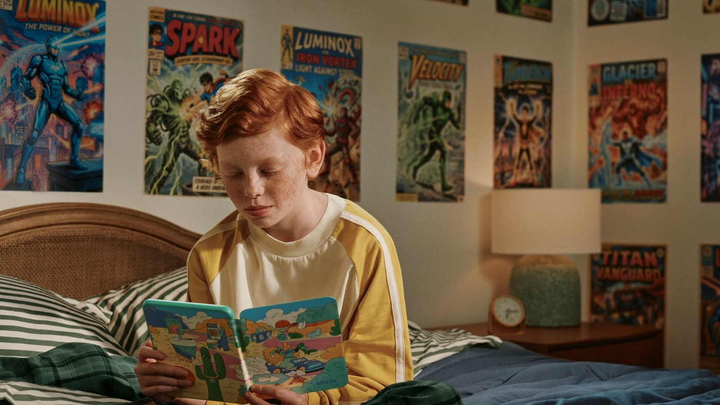 Child reading a Kids Kindle Colorsoft in a bedroom
