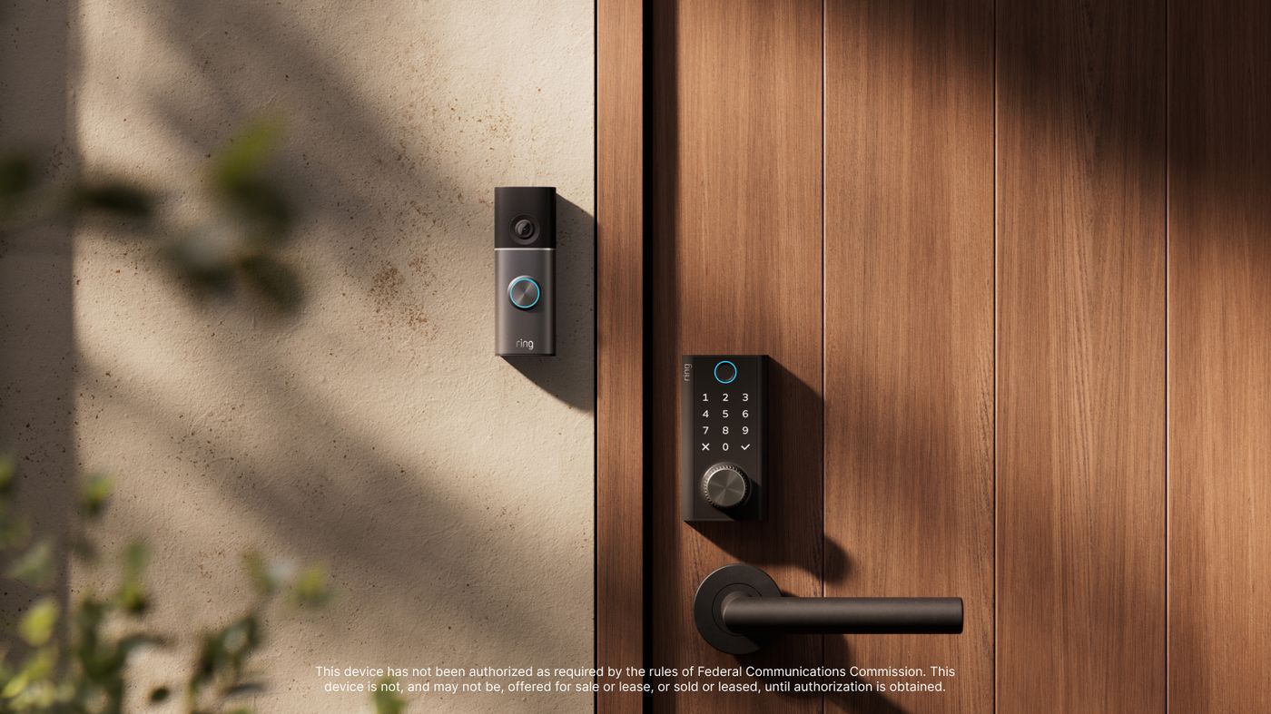The lock on a wooden door beside a Ring Video Doorbell, with the knurled Power Dial below the keypad