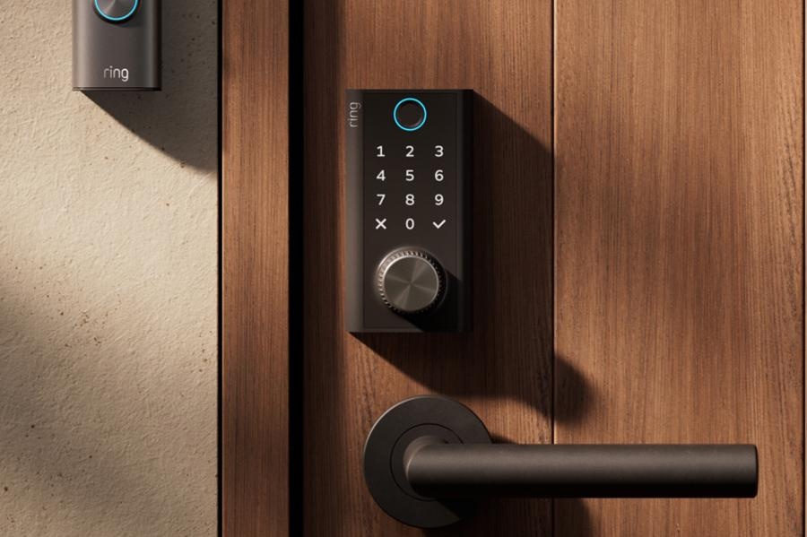 Close-up of the black Ring Smart Lock face, fingerprint ring, backlit keypad, and Power Dial