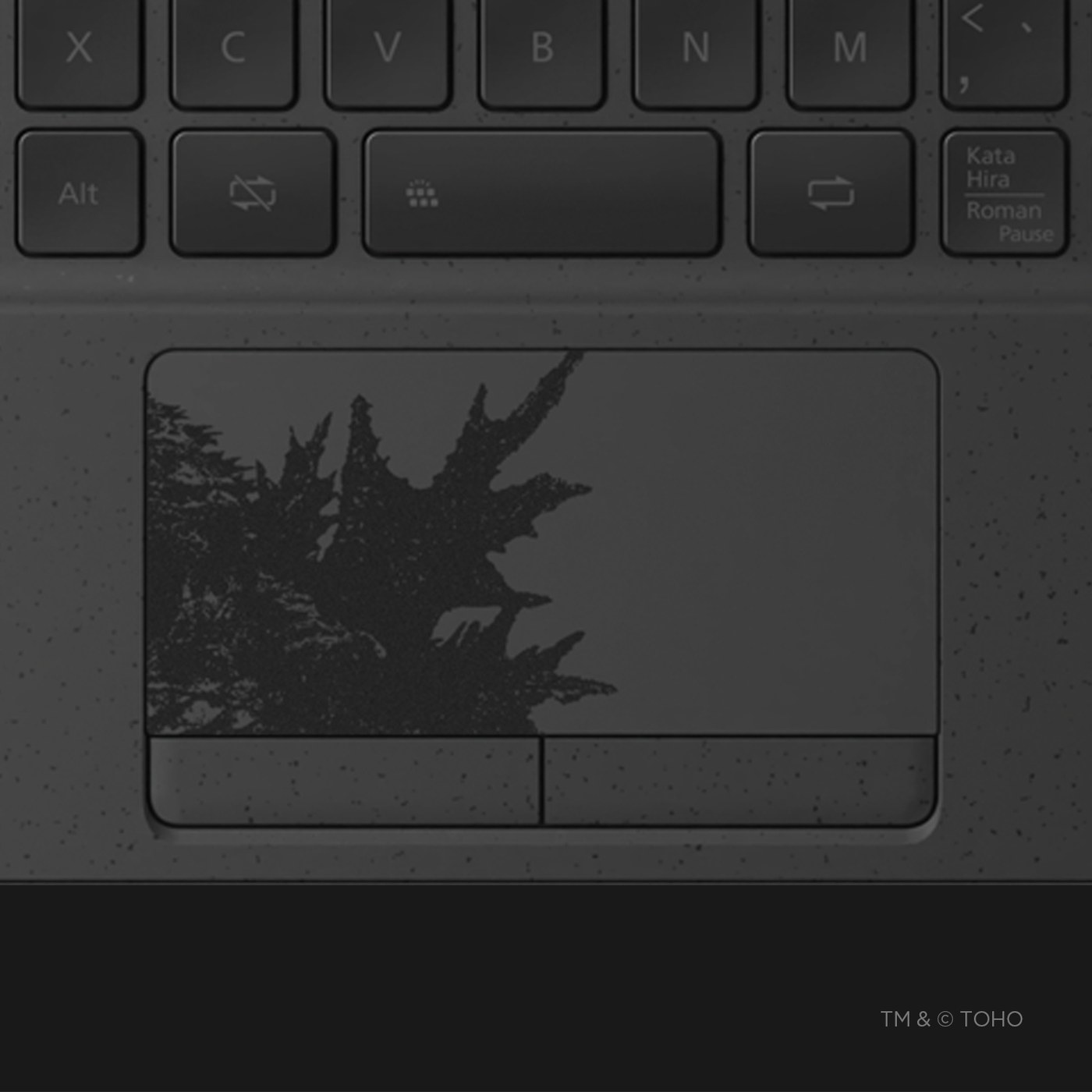 Godzilla’s dorsal fins are printed on the touchpad.