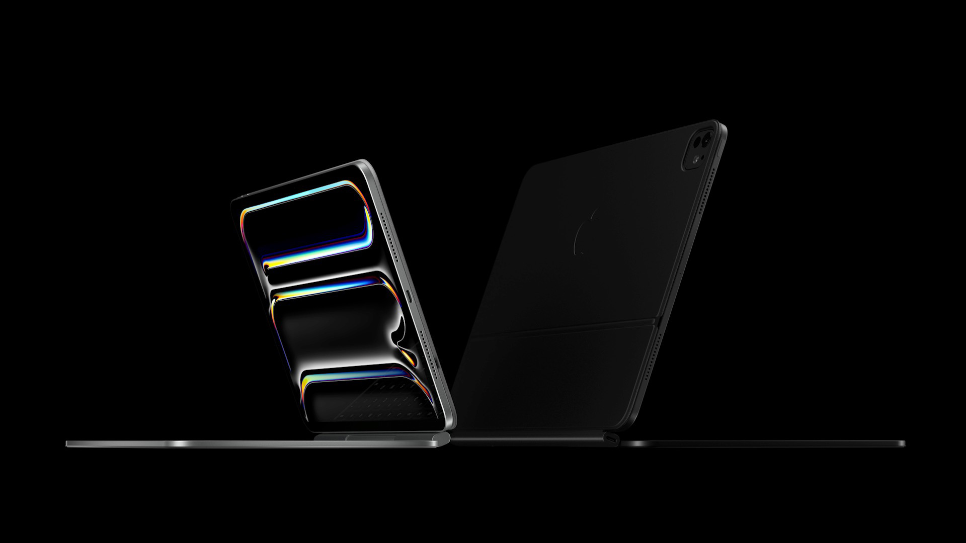 Two iPad Pro tablets in Magic Keyboard cases showing Ultra Retina XDR displays
