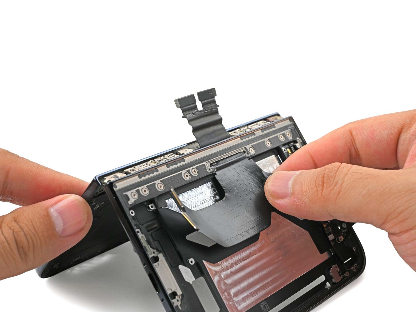 The accordion-pleated cable that carries power and data across the hinge.
