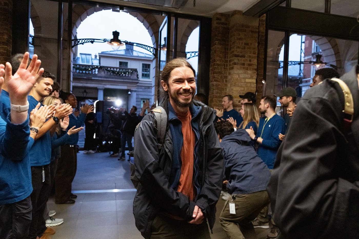 Staff at Apple Covent Garden in London welcome the first customer.