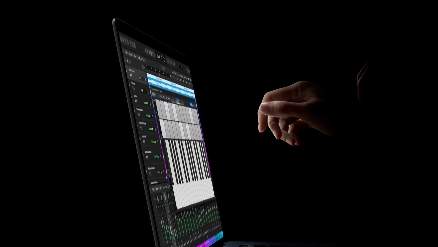 Playing a software keyboard on screen in Logic Pro.