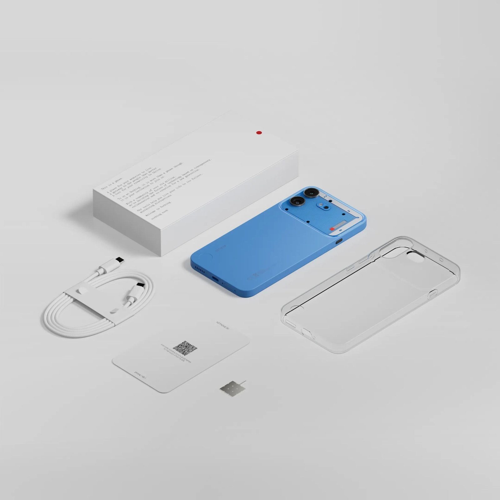 Nothing Phone (4b) in blue with box, cable, SIM tool, and clear case