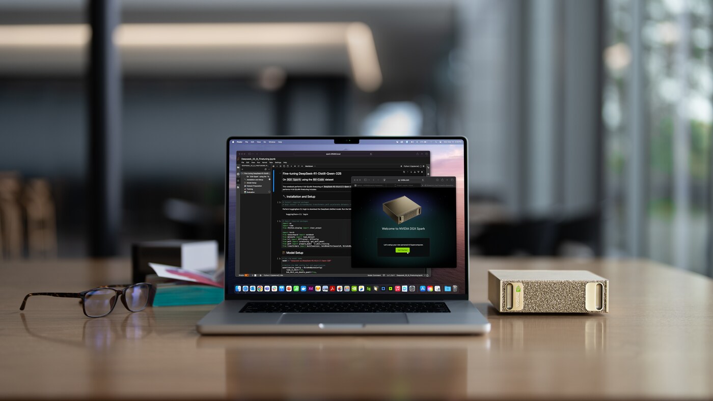A laptop on a desk beside a gold NVIDIA DGX Spark box showing a DGX Spark setup screen