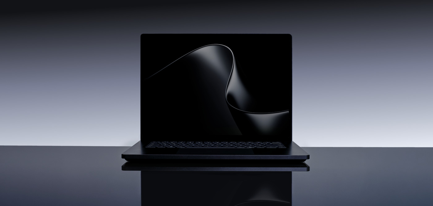 Black Surface Laptop Ultra on a gradient backdrop