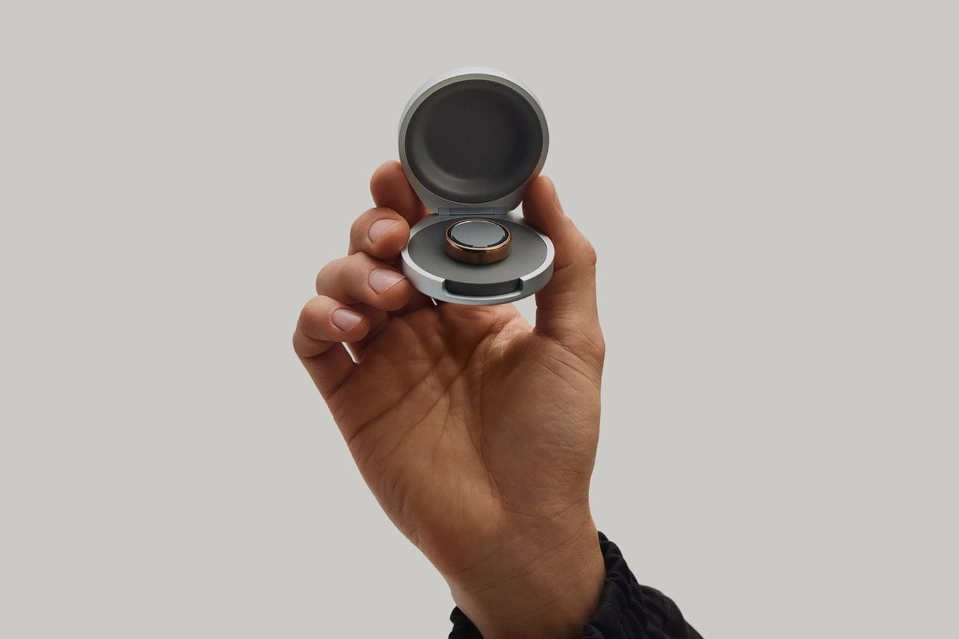 Oura Ring 5 in its charging case.