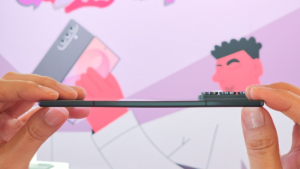 Side profile of an unfolded Galaxy Z Fold 8 held between two hands