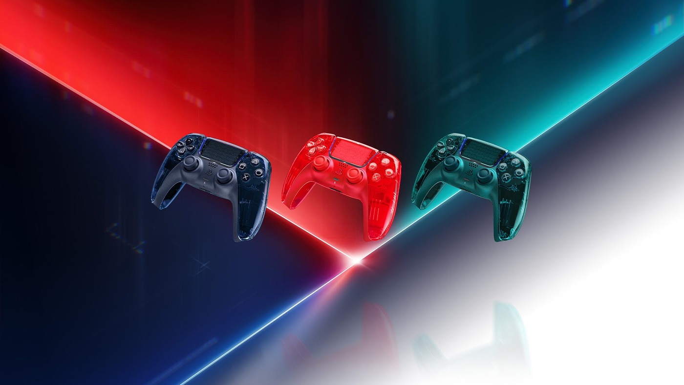 The Prism Collection DualSense controllers in Graphite Gray, Flare Orange and Emerald Green.