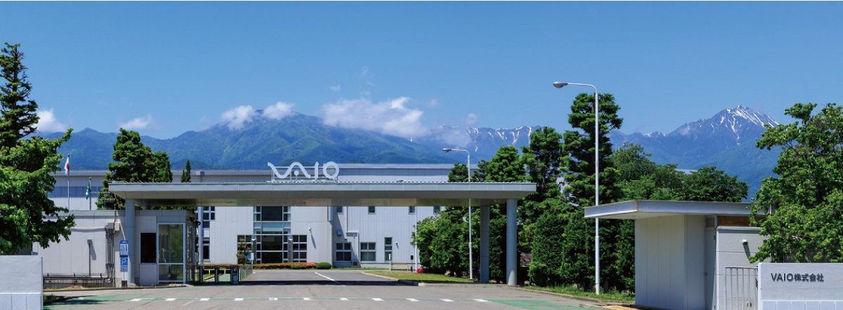 VAIO headquarters gate in Azumino, with mountains behind the factory campus