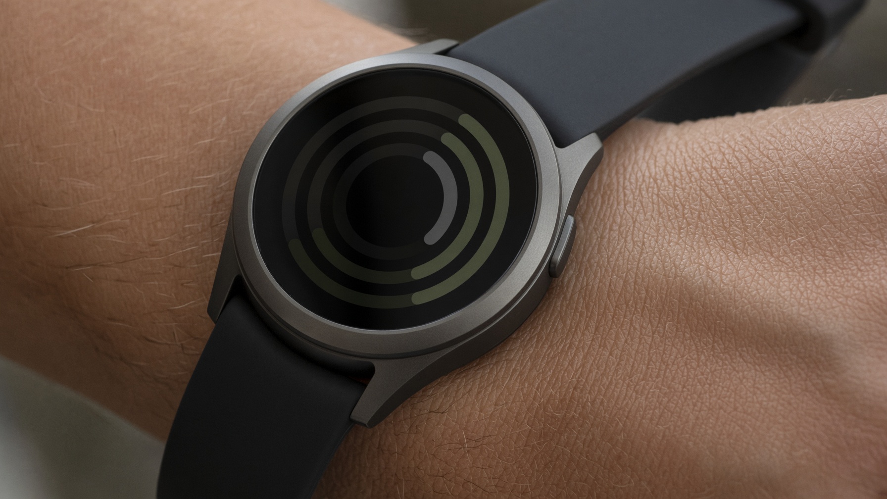 Close-up of a titanium smartwatch on a wrist