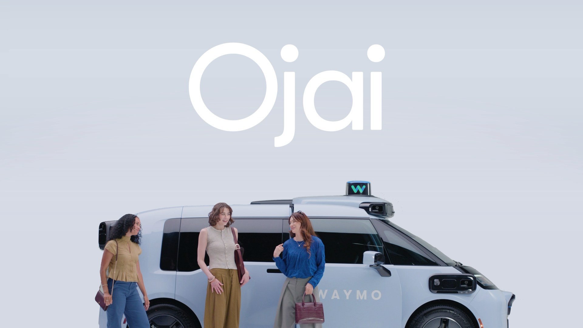 A white Jaguar I-PACE Waymo robotaxi