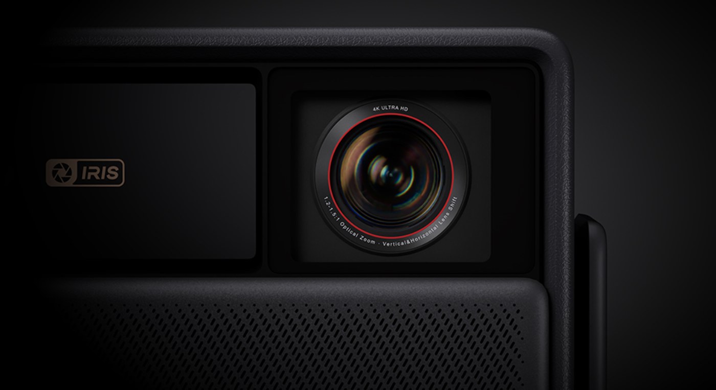 The lens and variable iris on the front of the projector.