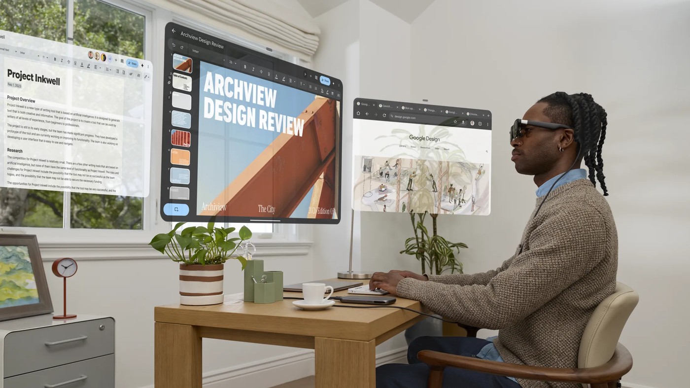 Xreal Aura projects app windows around the wearer while the transparent lenses keep the room in view.