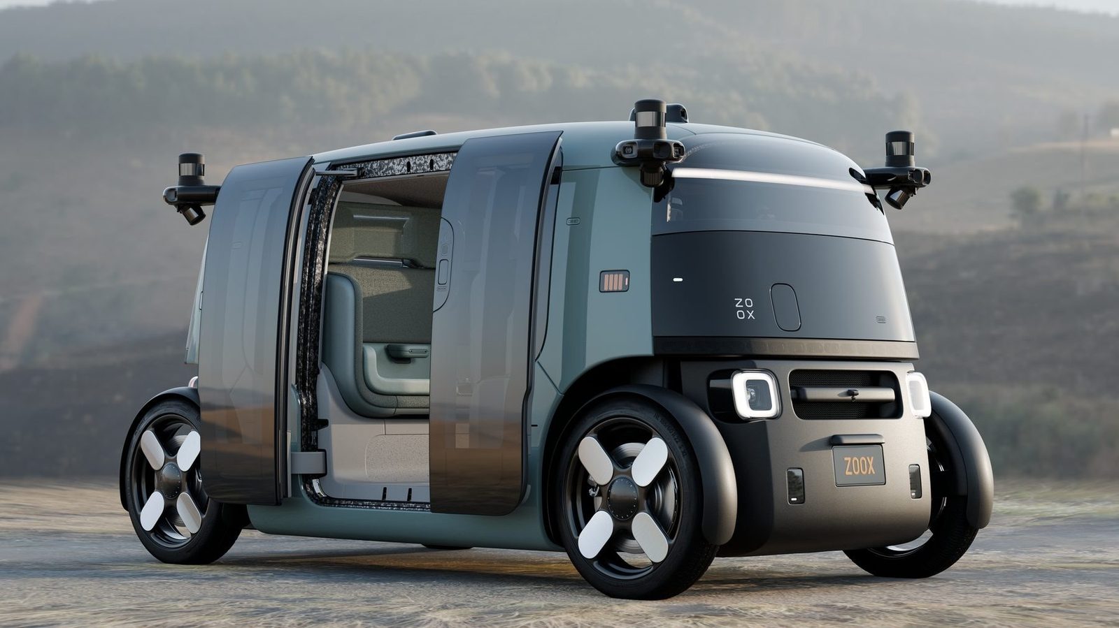 A Zoox robotaxi with sliding doors open, parked on a rural road
